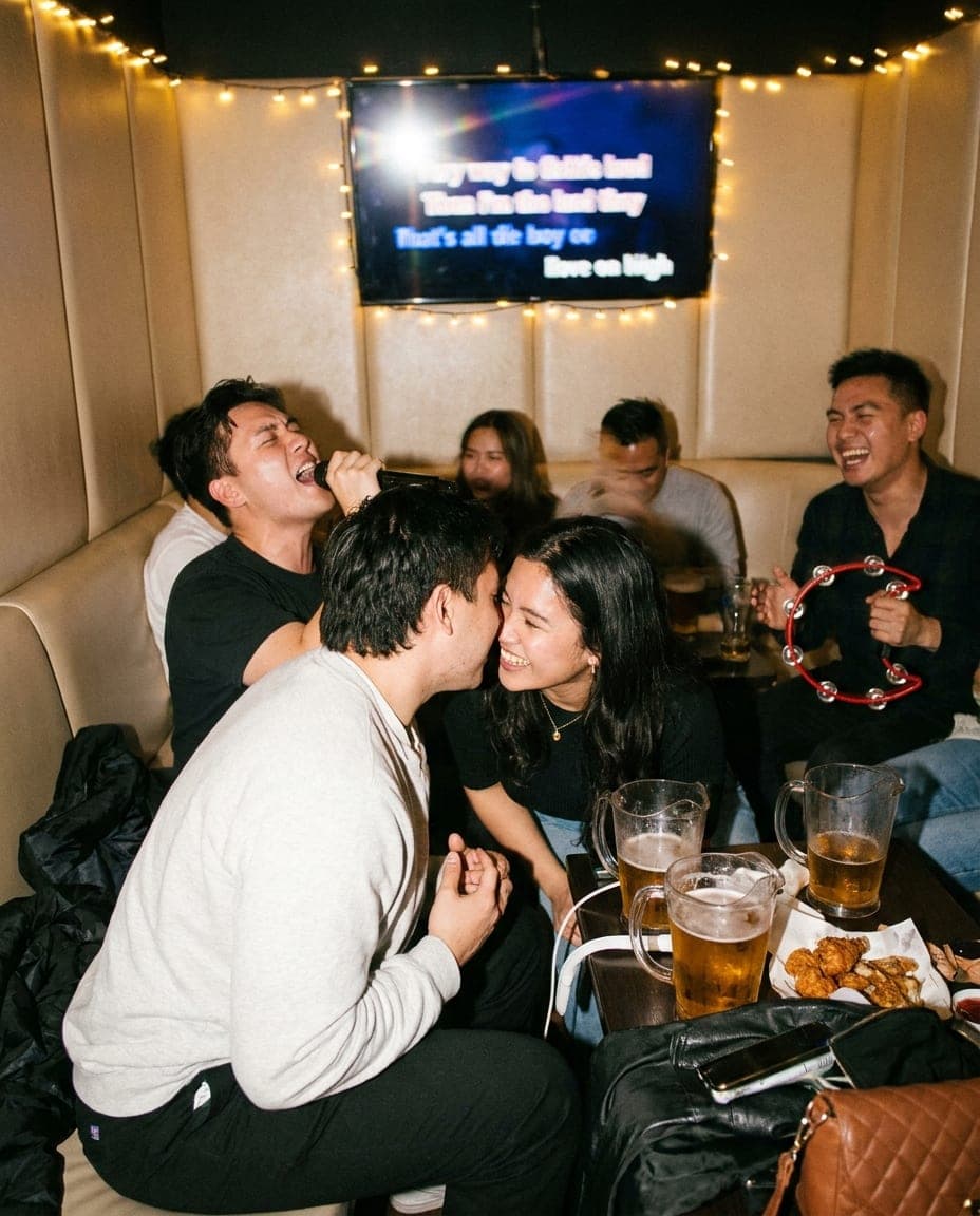 Friends mid-song in a private karaoke room in Haymarket