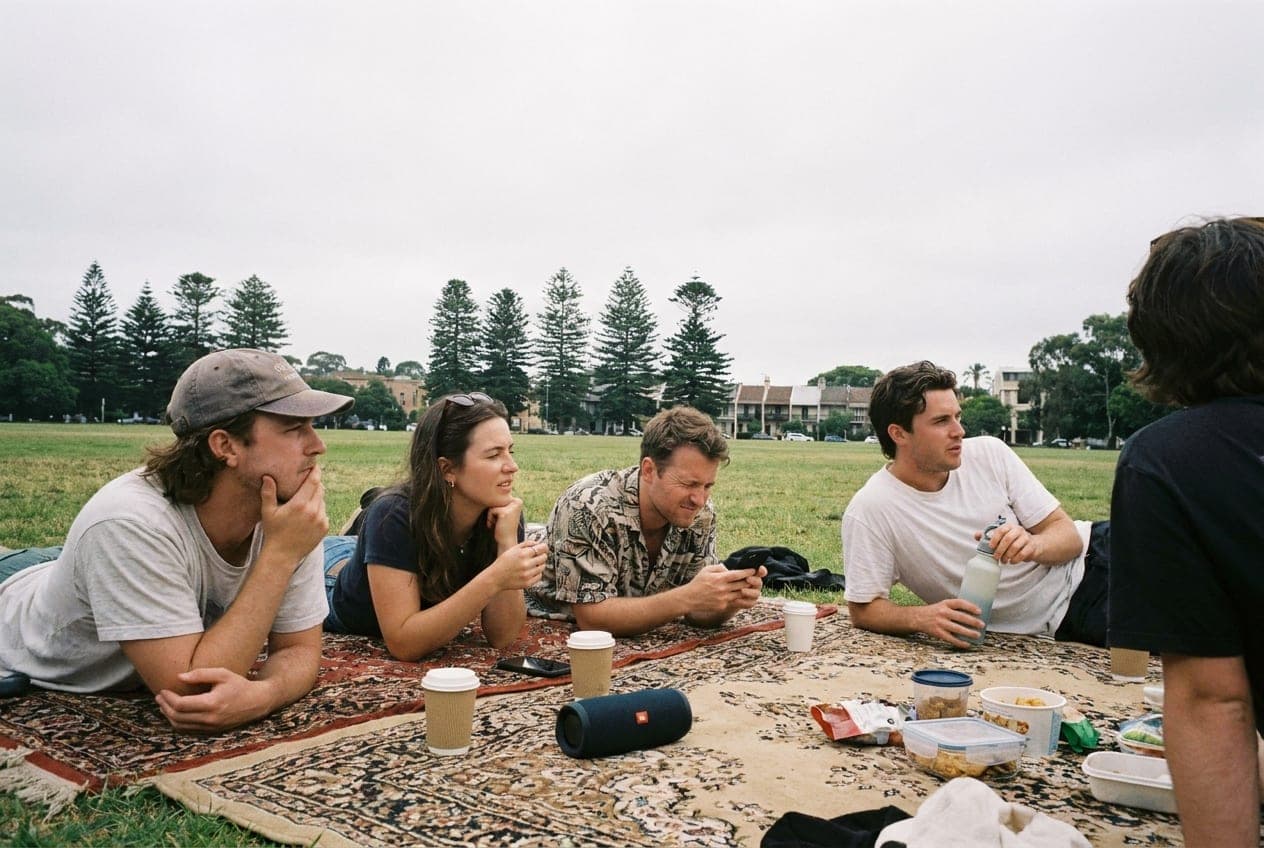 A picnic mixer on the grass in Centennial Park, long shadows