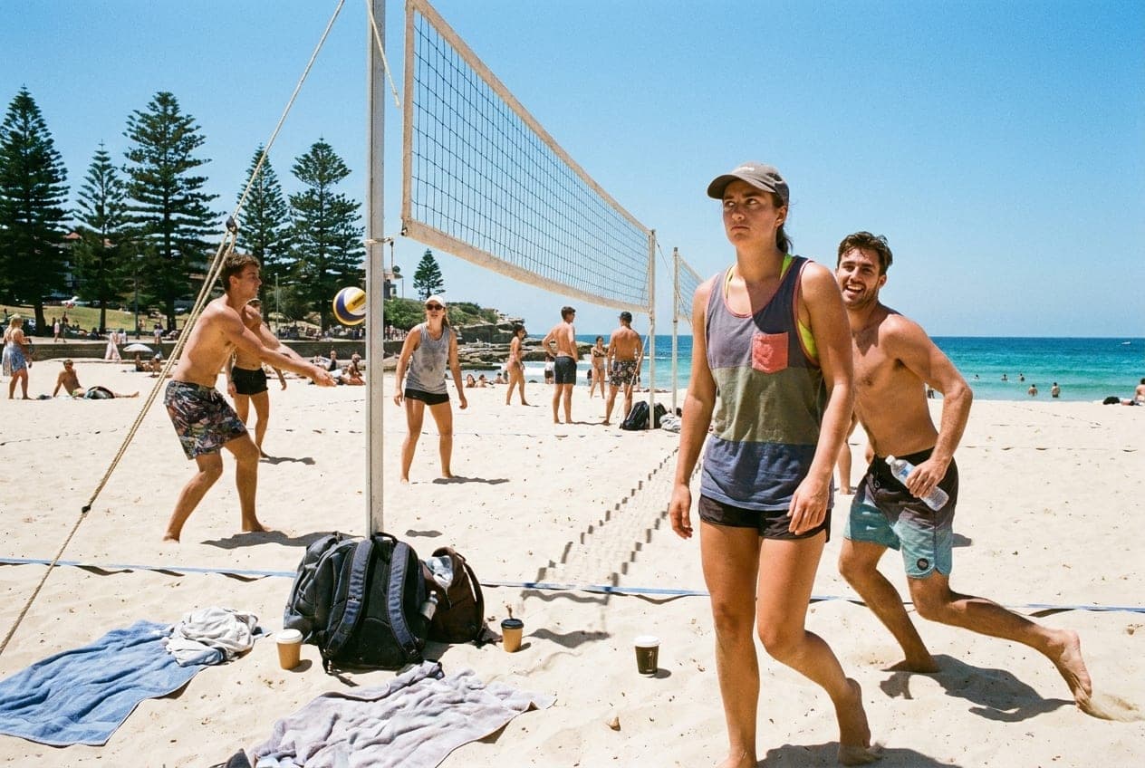 A casual beach volleyball social at Bondi at golden hour